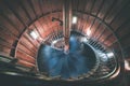 A spiral staircase inside a lighthouse. - vintage film effect