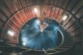 A spiral staircase inside a lighthouse. - vintage film effect