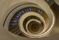 Spiral Staircase Leads Down Several Floors With Dramatic Lighting Royalty Free Stock Photo