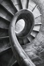 Spiral staircase from a low angle, highlighting the curves and architectural details