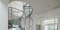 Spiral staircase made of glass and metal in luxury house. Royalty Free Stock Photo