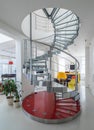 Spiral staircase made of metal and glass in luxury private house. Royalty Free Stock Photo