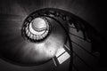 Spiral staircase in old building, bottom view of circular stair. Wooden round stairway in house interior, effect of hypnosis and