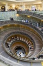 spiral staircase with people walking around seen from above from inside the vatican museum, italy Royalty Free Stock Photo