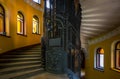 Spiral staircase and vintage metal elevator in historical house in downtown Saint-Petersburg