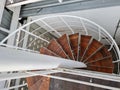 Spiral staircase, wooden material on white steel structure Royalty Free Stock Photo