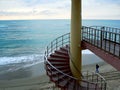 Spiral staircases on the beach of the bay of Cadiz, Andalusia. Spain. Royalty Free Stock Photo