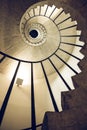 Spiral staircases, section and golden spiral. Stairwell. Ancient architecture. View from bottom to top