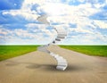 Spiral stairs in sky with green grass, road and Royalty Free Stock Photo