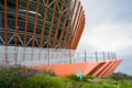 Spiral walkway of modern viewing platform in cloudy summer after rain