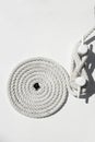 Spiral white sea nautical rope on boat mooring Royalty Free Stock Photo