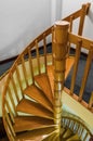 Spiral wooden staircase with varnished balusters Royalty Free Stock Photo