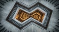 Spiraling stairwell viewed from above, creating a geometric, symmetrical pattern.