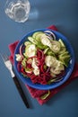 Spiralized beet and cucumber salad with avocado dressing, health