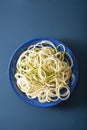 Spiralized courgette raw vegetable noodles on plate