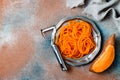 Spiralized sweet potato spaghetti. Low carb vegetable pasta cooking.