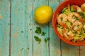 Spiralized Zucchini with jumbo shrimp on wood board