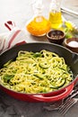 Spiralized zucchini noodles in a cast iron pan