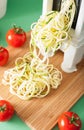 Spiralizing courgette raw vegetable with spiralizer Royalty Free Stock Photo