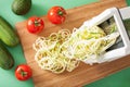 Spiralizing courgette raw vegetable with spiralizer Royalty Free Stock Photo