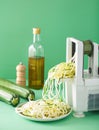 Spiralizing courgette raw vegetable with spiralizer Royalty Free Stock Photo