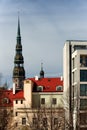 Spire of the cathedral with a on a background of the old to Royalty Free Stock Photo