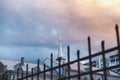 Spire of Catholic church with cross and wrought fence Royalty Free Stock Photo