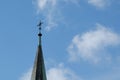 The spire of the Christian church with a cross on a background of blue sky Royalty Free Stock Photo