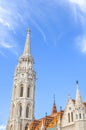 The spire of the famous Matthias Church in Budapest, Hungary. Roman Catholic church built in the Gothic style. Orange colored tile Royalty Free Stock Photo