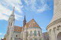 The spire of the famous Matthias Church in Budapest, Hungary. Roman Catholic church built in the Gothic style. Orange colored tile Royalty Free Stock Photo