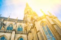 Spire of the New Dome gothic cathedral in Linz Austria. Low angle perspective. Blue sky golden sunlight. Close up Royalty Free Stock Photo