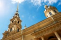 The spire of the Peter and Paul Cathedral against the background of the blue sky.