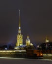 Spire of the Peter and Paul fortress on the background of sunset glow, night, beautiful lighting, horizontal shot. Symbol of Saint