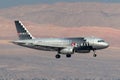 Spirit Airlines Airbus A319 regional airliner on approach to land at McCarran International Airport in Las Vegas at night