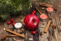 Spirit Christmas background. New Year tree, fresh apple, cinnamon, dog rose, candles, cardamom, star anise. Nature decorations,