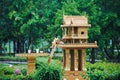 Spirit house in thailand with garland and some wreathes, joss house