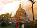 Spirit house in thailand with garland and some wreathes,