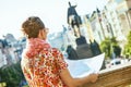 Traveller woman on Wenceslas Square in Prague with map