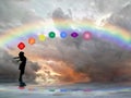 Spiritual background with chakras, human silhouette and rainbow in sea reflection Royalty Free Stock Photo