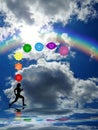 Spiritual background with chakras, human silhouette and rainbow in sea reflection Royalty Free Stock Photo