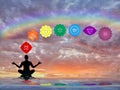 Spiritual background with chakras, human silhouette and rainbow in sea reflection Royalty Free Stock Photo