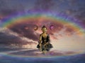 Spiritual background for meditation with buddha statue, rainbow, yin yang symbol isolated in clouds sky background