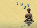 Spiritual background for meditation with buddha statue and yin yang symbol isolated in golden background Royalty Free Stock Photo