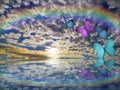 Spiritual background for meditation with butterflies, stormy clouds and rainbow in sea reflection Royalty Free Stock Photo