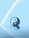 Spiritual background for meditation with yin yang symbol and rainbow in sea reflection Royalty Free Stock Photo