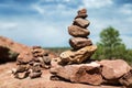 Spiritual cairn of red rocks in the desert