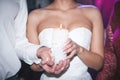 Spiritual couple, bride and groom holding candles during wedding ceremony in christian church, emotional moment during Royalty Free Stock Photo