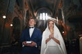 Spiritual couple praying at wedding ceremony church