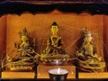 Spiritual idol of Lord Buddha, Goddess Tara and Padmasambhava made up of shiny golden material kept in a Gompa Tibetan monastery.