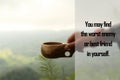 Spiritual inspirational quote - You may find the worst enemy or best friend in yourself. With hand of person holding tea cup. Royalty Free Stock Photo